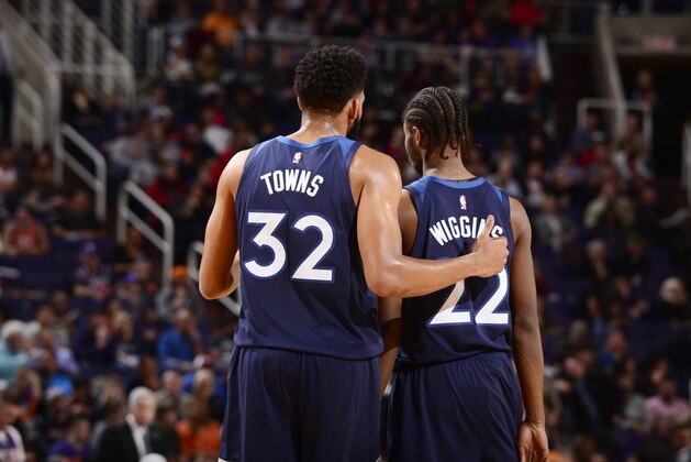 PHOENIX, AZ - JANUARY 22:  Karl-Anthony Towns #32 and Andrew Wiggins #22 of the Minnesota Timberwolves look on against the Phoenix Suns on January 22, 2019 at Talking Stick Resort Arena in Phoenix, Arizona. NOTE TO USER: User expressly acknowledges and agrees that, by downloading and or using this photograph, user is consenting to the terms and conditions of the Getty Images License Agreement. Mandatory Copyright Notice: Copyright 2019 NBAE (Photo by Barry Gossage/NBAE via Getty Images)