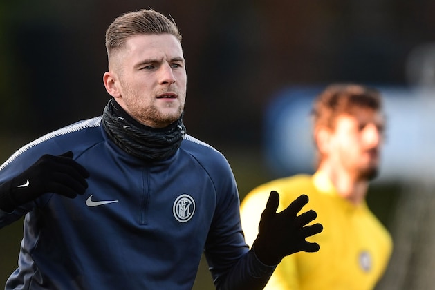 Inter Milan's Slovak defender Milan Skriniar stretches during a training session on the eve of the UEFA Champions League group B football match Inter Milan vs PSV Eindhoven on December 10, 2018 at the training ground of Appiano Gentile, north of Milan. (Photo by Miguel MEDINA / AFP)        (Photo credit should read MIGUEL MEDINA/AFP/Getty Images)