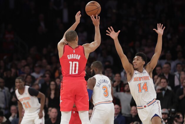 Houston Rockets' Eric Gordon (10) shoots a 3-point basket over New York Knicks' Allonzo Trier (14) during the second half of an NBA basketball game Wednesday, Jan. 23, 2019, in New York. The Rockets won 114-110. (AP Photo/Frank Franklin II)