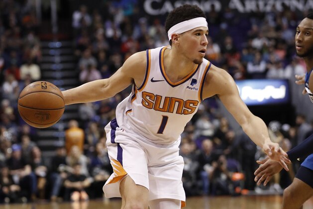 Phoenix Suns guard Devin Booker (1) drives against the Minnesota Timberwolves during the second half of an NBA basketball game, Tuesday, Jan. 22, 2019, in Phoenix. (AP Photo/Matt York)