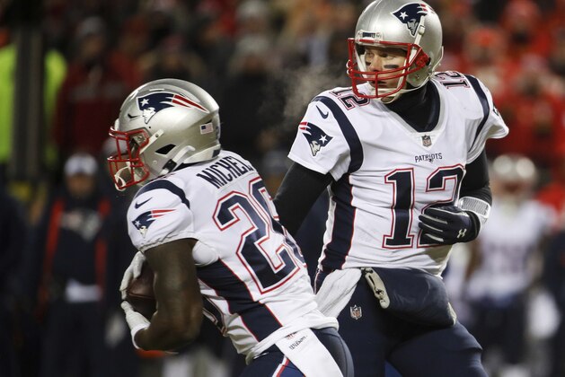 New England Patriots quarterback Tom Brady hands off the ball to running back Sony Michel (26) during the first half of the AFC Championship NFL football game, Sunday, Jan. 20, 2019, in Kansas City, Mo. (AP Photo/Charlie Riedel)