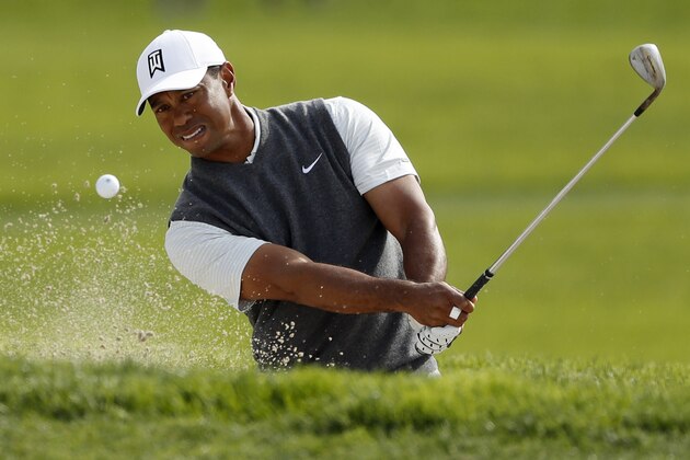 Tiger Woods hits out of a bunker on the sixth hole of the South Course at Torrey Pines Golf Course during the first round of the Farmers Insurance golf tournament Thursday, Jan. 24, 2019, in San Diego. (AP Photo/Gregory Bull)