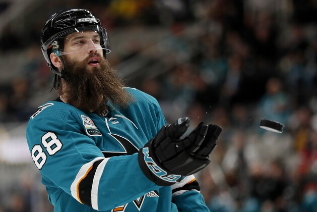San Jose Sharks' Brent Burns (88) tosses the puck during break in the action against the New Jersey Devils in the third period of an NHL hockey game in San Jose, Calif., Monday, Dec. 10, 2018. (AP Photo/Josie Lepe)