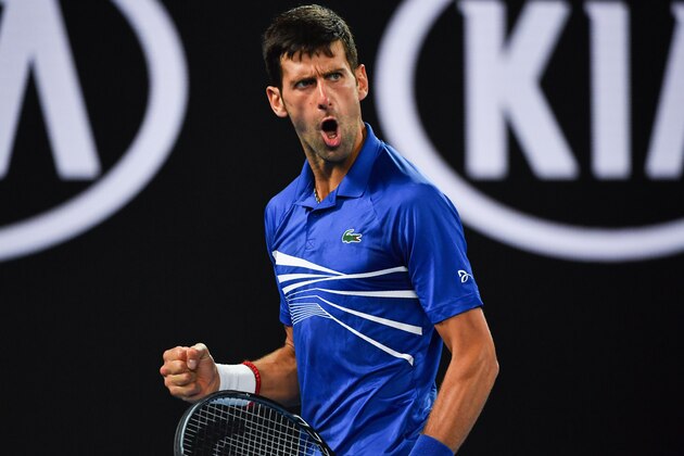 Serbia's Novak Djokovic reacts after a point against France's Lucas Pouille during their men's singles semi-final match on day 12 of the Australian Open tennis tournament in Melbourne on January 25, 2019. (Photo by Paul Crock / AFP) / -- IMAGE RESTRICTED TO EDITORIAL USE - STRICTLY NO COMMERCIAL USE --        (Photo credit should read PAUL CROCK/AFP/Getty Images)