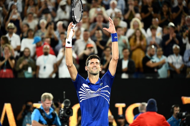 Serbia's Novak Djokovic celebrates his victory against France's Lucas Pouille during their men's singles semi-final match on day 12 of the Australian Open tennis tournament in Melbourne on January 25, 2019. (Photo by Jewel SAMAD / AFP) / -- IMAGE RESTRICTED TO EDITORIAL USE - STRICTLY NO COMMERCIAL USE --        (Photo credit should read JEWEL SAMAD/AFP/Getty Images)