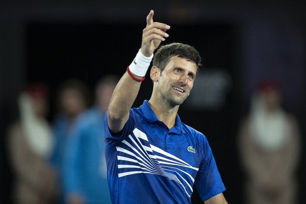 MELBOURNE, AUSTRALIA - JANUARY 25:  Novak Djokovic of Serbia celebrates winning match point in his men's semi final match against Lucas Pouille of France during day 12 of the 2019 Australian Open at Melbourne Park on January 25, 2019 in Melbourne, Australia.(Photo by Fred Lee/Getty Images)