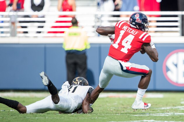 OXFORD, MS - OCTOBER 14: Wide receiver D.K. Metcalf #14 of the Mississippi Rebels escapes a tackle by cornerback Tre Herndon #31 of the Vanderbilt Commodores at Vaught-Hemingway Stadium on October 14, 2017 in Oxford, Mississippi. (Photo by Michael Chang/Getty Images)