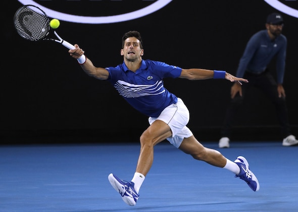 Serbia's Novak Djokovic makes a forehand return to France's Lucas Pouille during their semifinal at the Australian Open tennis championships in Melbourne, Australia, Friday, Jan. 25, 2019. (AP Photo/Mark Schiefelbein) Serbia's Novak Djokovic makes a forehand return to France's Lucas Pouille during their semifinal at the Australian Open tennis championships in Melbourne, Australia, Friday, Jan. 25, 2019. (AP Photo/Mark Schiefelbein)