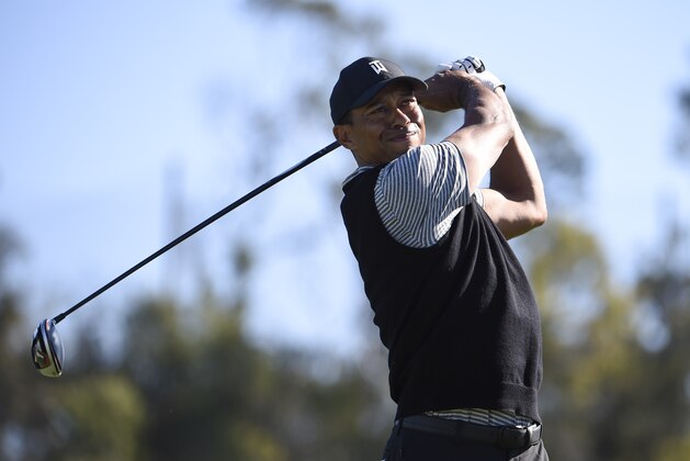 Tiger Woods hits his tee shot on the 14th hole during the second round of the Farmers Insurance Open golf tournament on the North Course at the Torrey Pines on Friday, Jan. 25, 2019, in San Diego. (AP Photo/Denis Poroy)