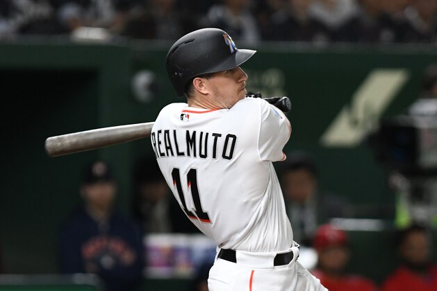 J.T. Realmuto of the Miami Marlins hits a three-run homer during the eighth inning of the second exhibition baseball game between the US Major League Baseball All Star team and the Japanese national team at the Tokyo Dome in Tokyo on November 10, 2018. (Photo by Kazuhiro NOGI / AFP)        (Photo credit should read KAZUHIRO NOGI/AFP/Getty Images)