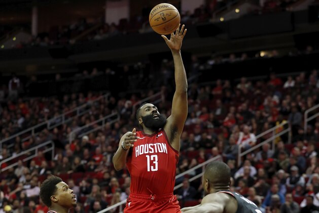 HOUSTON, TX - JANUARY 25:  James Harden #13 of the Houston Rockets goes up for a shot defended by Kyle Lowry #7 of the Toronto Raptors and Serge Ibaka #9 in the first half at Toyota Center on January 25, 2019 in Houston, Texas.  NOTE TO USER: User expressly acknowledges and agrees that, by downloading and or using this photograph, User is consenting to the terms and conditions of the Getty Images License Agreement.  (Photo by Tim Warner/Getty Images)