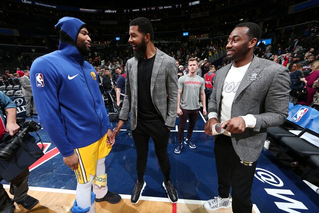 WASHINGTON, DC -  JANUARY 24: DeMarcus Cousins #0 of the Golden State Warriors, Markieff Morris #5 of the Washington Wizards, and John Wall #2 of the Washington Wizards share a moment following the game on January 24, 2019 at Capital One Arena in Washington, DC. NOTE TO USER: User expressly acknowledges and agrees that, by downloading and or using this Photograph, user is consenting to the terms and conditions of the Getty Images License Agreement. Mandatory Copyright Notice: Copyright 2019 NBAE (Photo by Ned Dishman/NBAE via Getty Images)