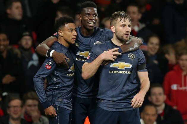 Manchester United's English midfielder Jesse Lingard (L) celebrates with Manchester United's French midfielder Paul Pogba (C) and Manchester United's English defender Luke Shaw (R) after scoring their second goal during the English FA Cup fourth round football match between Arsenal and Manchester United at the Emirates Stadium in London on January 25, 2019. (Photo by Daniel LEAL-OLIVAS / AFP) / RESTRICTED TO EDITORIAL USE. No use with unauthorized audio, video, data, fixture lists, club/league logos or 'live' services. Online in-match use limited to 120 images. An additional 40 images may be used in extra time. No video emulation. Social media in-match use limited to 120 images. An additional 40 images may be used in extra time. No use in betting publications, games or single club/league/player publications. /         (Photo credit should read DANIEL LEAL-OLIVAS/AFP/Getty Images)