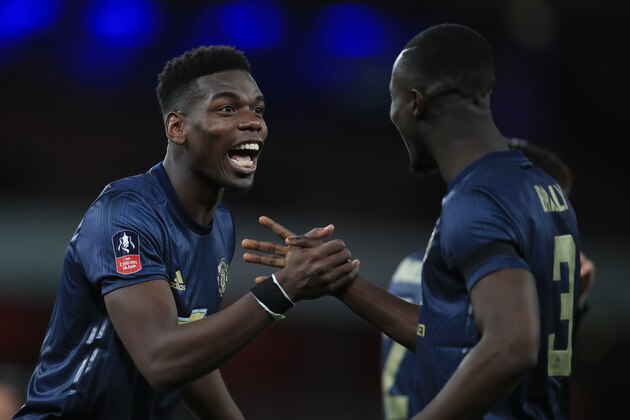 LONDON, ENGLAND - JANUARY 25: Paul Pogba of Manchester United celebrates with Eric Bailly during the FA Cup Fourth Round match between Arsenal and Manchester United at Emirates Stadium on January 25, 2019 in London, United Kingdom. (Photo by Marc Atkins/Getty Images)