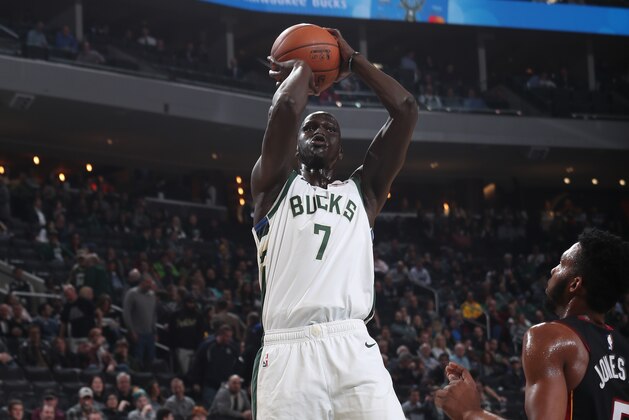 MILWAUKEE, WI - JANUARY 15: Thon Maker #7 of the Milwaukee Bucks shoots the ball against the Miami Heat on January 15, 2019 at the Fiserv Forum Center in Milwaukee, Wisconsin. NOTE TO USER: User expressly acknowledges and agrees that, by downloading and or using this Photograph, user is consenting to the terms and conditions of the Getty Images License Agreement. Mandatory Copyright Notice: Copyright 2019 NBAE (Photo by Gary Dineen/NBAE via Getty Images).