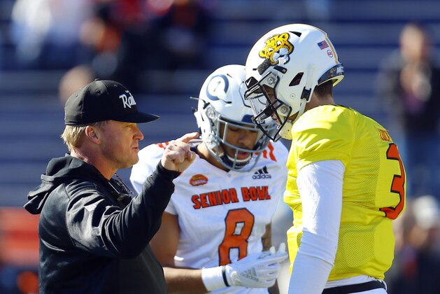North head coach Jon Gruden of the Oakland Raiders talks with North quarterback Drew Lock of Missouri (3) during practice for Saturday's Senior Bowl NCAA college football game, Thursday, Jan. 24, 2019, in Mobile, Ala. (AP Photo/Butch Dill)