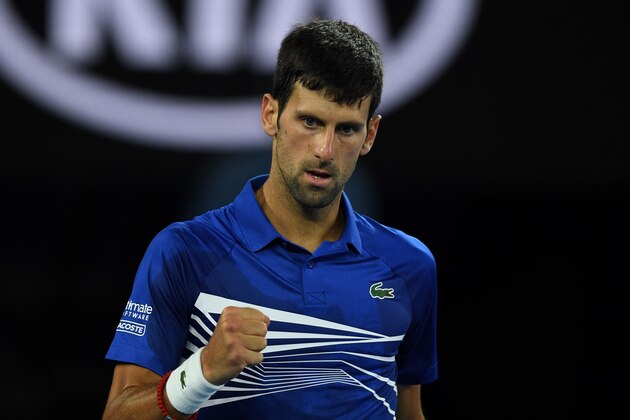 Serbia's Novak Djokovic reacts after a point against Spain's Rafael Nadal during the men's singles final on day 14 of the Australian Open tennis tournament in Melbourne on January 27, 2019. (Photo by Greg Wood / AFP) / -- IMAGE RESTRICTED TO EDITORIAL USE - STRICTLY NO COMMERCIAL USE --        (Photo credit should read GREG WOOD/AFP/Getty Images)