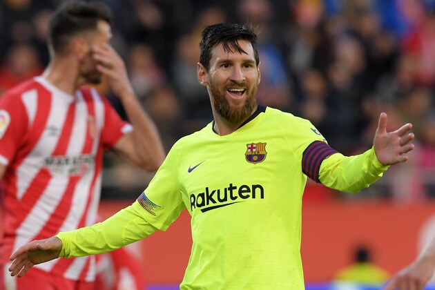 Barcelona's Argentinian forward Lionel Messi celebrates after scoring a goal during the Spanish league football match between Girona FC and FC Barcelona at the Montilivi stadium in Girona on January 27, 2019. (Photo by LLUIS GENE / AFP)        (Photo credit should read LLUIS GENE/AFP/Getty Images)