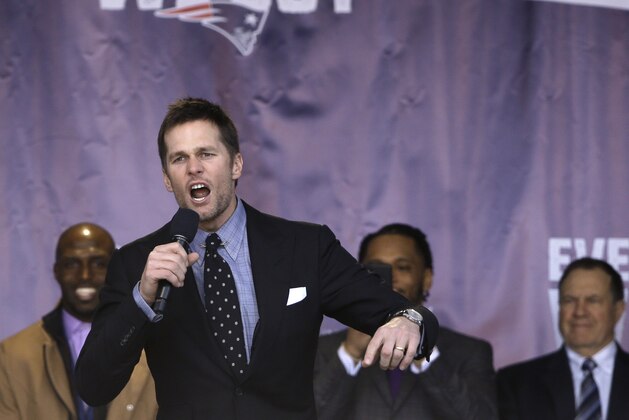 New England Patriots quarterback Tom Brady, front, addresses the crowd as free safety Devin McCourty, left, and head coach Bill Belichick, right, look on during an NFL football Super Bowl send-off rally for the team, Sunday, Jan. 27, 2019, in Foxborough, Mass. The Los Angeles Rams are to play the Patriots in the Super Bowl on Feb. 3, in Atlanta, Ga. (AP Photo/Steven Senne)