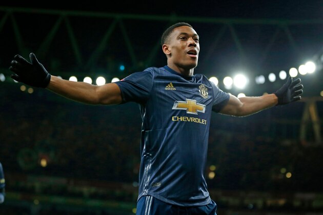 Manchester United's French striker Anthony Martial celebrates after scoring their third goal during the English FA Cup fourth round football match between Arsenal and Manchester United at the Emirates Stadium in London on January 25, 2019. - Manchester United won the game 3-1. (Photo by Ian KINGTON / IKIMAGES / AFP) / RESTRICTED TO EDITORIAL USE. No use with unauthorized audio, video, data, fixture lists, club/league logos or 'live' services. Online in-match use limited to 45 images, no video emulation. No use in betting, games or single club/league/player publications.        (Photo credit should read IAN KINGTON/AFP/Getty Images)