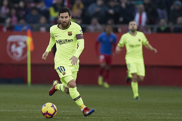 GIRONA, SPAIN - JANUARY 27: Lionel Messi of Barcelona runs with the ball during the La Liga match between Girona FC and FC Barcelona at Montilivi Stadium on January 27, 2019 in Girona, Spain. (Photo by Quality Sport Images/Getty Images)