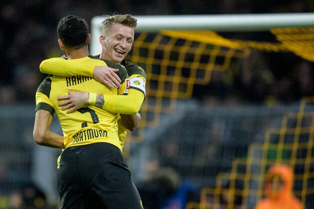 DORTMUND, GERMANY - JANUARY 26: Achraf Hakimi of Dortmund celebrates his goal for the 1-0 lead with Marco Reus during the Bundesliga match between Borussia Dortmund and Hannover 96 at the Signal Iduna Park on January 26, 2019 in Dortmund, Germany. (Photo by Jörg Schüler/Getty Images)