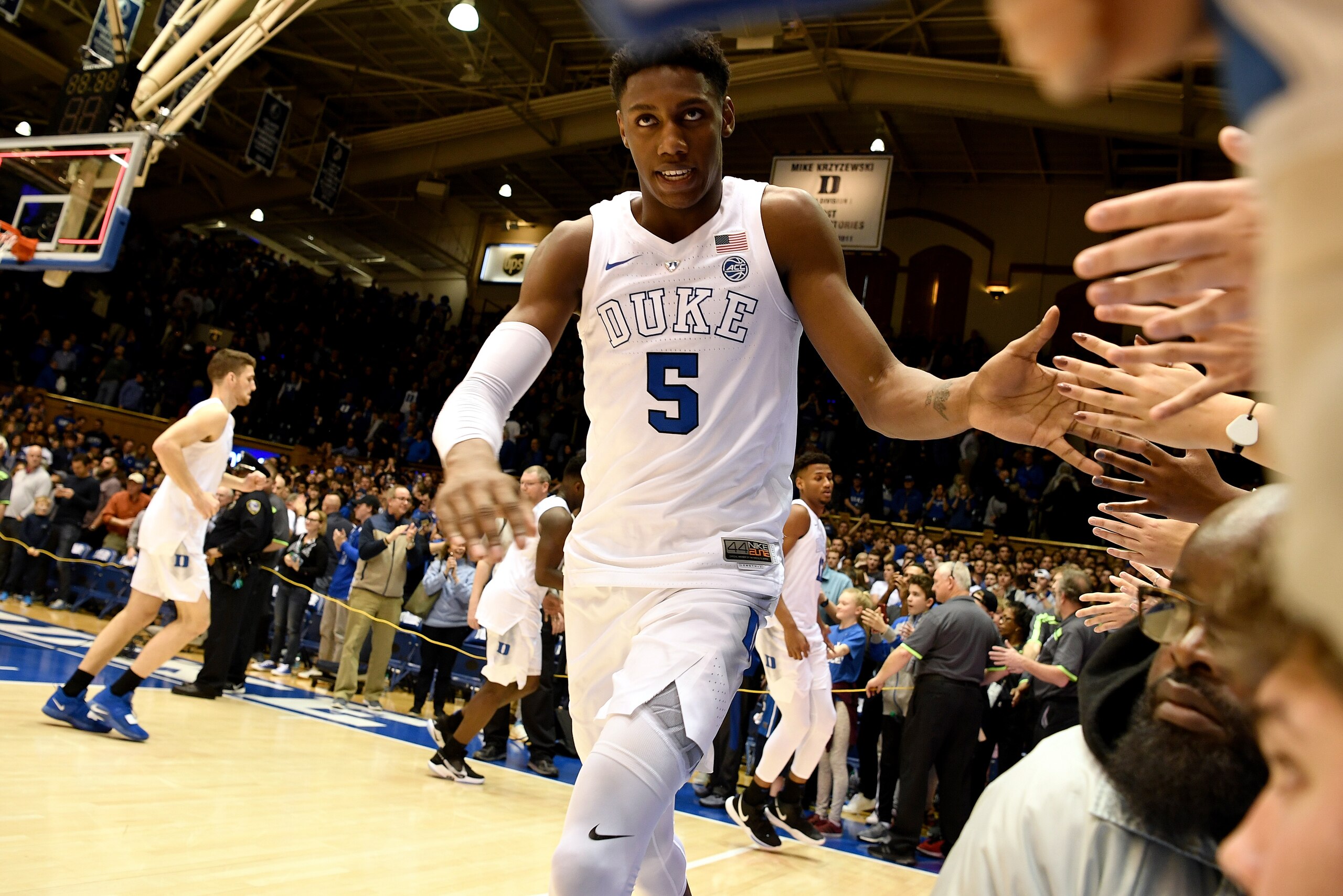 DURHAM, NC - JANUARY 26: RJ Barrett #5 of the Duke Blue Devils high-fives the Cameron Crazies following their 66-53 win against the Georgia Tech Yellow Jackets at Cameron Indoor Stadium on January 26, 2019 in Durham, North Carolina. (Photo by Lance King/Getty Images)