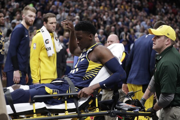 Indiana Pacers guard Victor Oladipo is taken off the court on a stretcher after he was injured during the first half of the team's NBA basketball game against the Toronto Raptors in Indianapolis, Wednesday, Jan. 23, 2019. (AP Photo/Michael Conroy)
