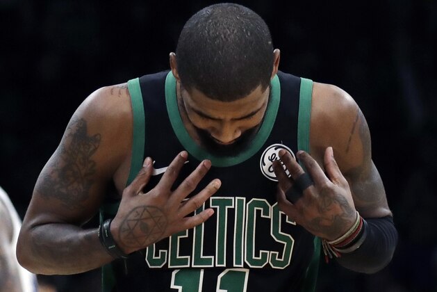Boston Celtics guard Kyrie Irving (11) reacts on the court in the second half of an NBA basketball game against the Golden State Warriors, Saturday, Jan. 26, 2019, in Boston. The Warriors won 115-111. (AP Photo/Elise Amendola)