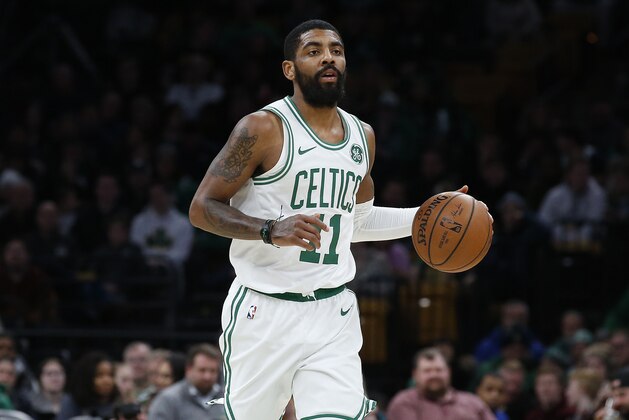 Boston Celtics' Kyrie Irving brings the ball up court during the second quarter of an NBA basketball game against the Miami Heat Monday, Jan. 21, 2019, in Boston. (AP Photo/Winslow Townson)