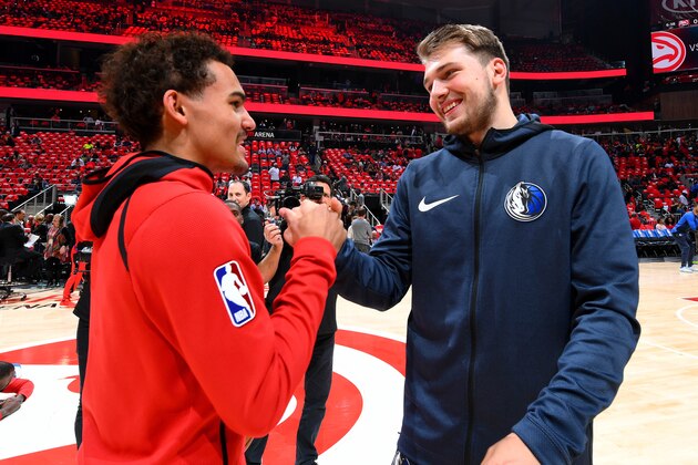 ATLANTA, GA - OCTOBER 24: Trae Young #11 of the Atlanta Hawks and Luka Doncic #77 of the Dallas Mavericks talk before the game on October 24, 2018 at State Farm Arena in Atlanta, Georgia. NOTE TO USER: User expressly acknowledges and agrees that, by downloading and/or using this photograph, user is consenting to the terms and conditions of the Getty Images License Agreement. Mandatory Copyright Notice: Copyright 2018 NBAE (Photo by Scott Cunningham/NBAE via Getty Images)