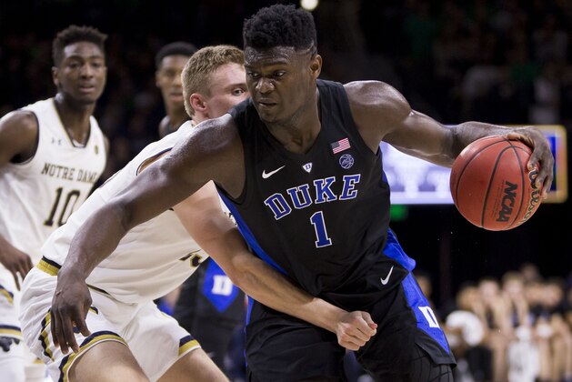 Duke's Zion Williamson (1) is defended by Notre Dame's Dane Goodwin (23) during the first half of an NCAA college basketball game Monday, Jan. 28, 2019, in South Bend, Ind. (AP Photo/Robert Franklin)
