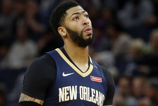 FILE- In this Jan. 12, 2019, file photo New Orleans Pelicans' Anthony Davis plays against the Minnesota Timberwolves in an NBA basketball game in Minneapolis. Davis' agent says the five-time All-Star has told the New Orleans Pelicans that he wants to be traded to a contending team. Agent Rich Paul confirmed the request to The Associated Press early Monday, Jan. 28. (AP Photo/Jim Mone, File)