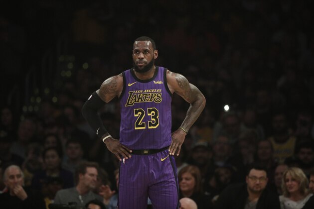 Los Angeles Lakers' LeBron James stands on the court during the first half of an NBA basketball game against the New Orleans Pelicans, Friday, Dec. 21, 2018, in Los Angeles. (AP Photo/Jae C. Hong)