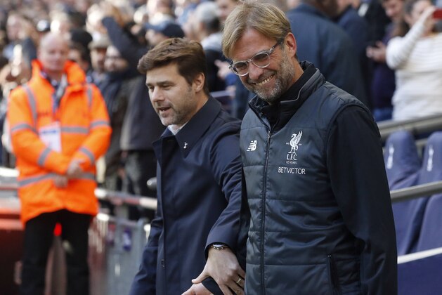 head coach Mauricio Pochettino , left, and Liverpool head coach Juergen Klopp prior to the English Premier League soccer match between Tottenham Hotspur and Liverpool at Wembley Stadium in London, Sunday, Oct. 22, 2017.(AP Photo/Frank Augstein)