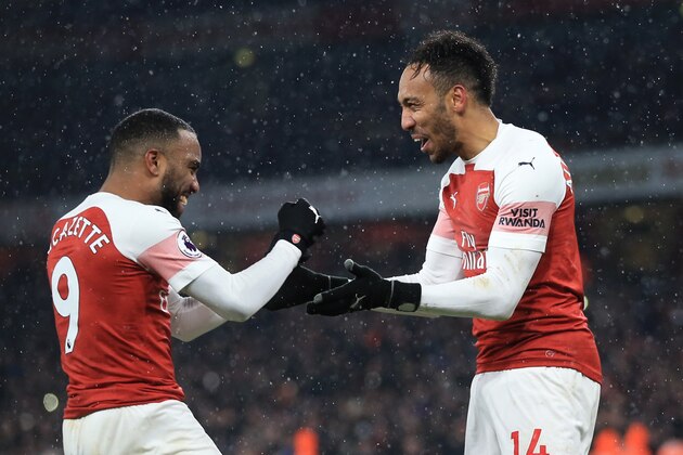 LONDON, ENGLAND - JANUARY 29:  Pierre-Emerick Aubameyang of Arsenal celebrates scoring from the penalty spot wit Alexandre Lacazette during the Premier League match between Arsenal FC and Cardiff City at Emirates Stadium on January 29, 2019 in London, United Kingdom. (Photo by Marc Atkins/Getty Images)