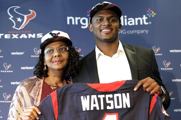 FILE - In this April 28, 2017, file photo, Houston Texans quarterback Deshaun Watson, right, poses with his mother Deann after an NFL football news conference in Houston. Watson's mother spent years encouraging him to chase his dreams. He has achieved one of his biggest goals of reaching the NFL. Now the Texans quarterback is giving back by renovating the home he grew up in and surprising his mom. (AP Photo/David J. Phillip, File)