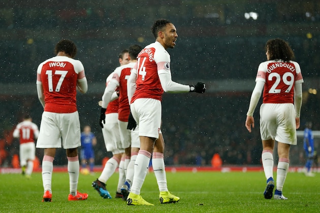 Arsenal's Gabonese striker Pierre-Emerick Aubameyang (C) celebrates after scoring from the penalty spot during the English Premier League football match between Arsenal and Cardiff City at the Emirates Stadium in London on January 29, 2019. (Photo by Ian KINGTON / AFP) / RESTRICTED TO EDITORIAL USE. No use with unauthorized audio, video, data, fixture lists, club/league logos or 'live' services. Online in-match use limited to 120 images. An additional 40 images may be used in extra time. No video emulation. Social media in-match use limited to 120 images. An additional 40 images may be used in extra time. No use in betting publications, games or single club/league/player publications. /         (Photo credit should read IAN KINGTON/AFP/Getty Images)