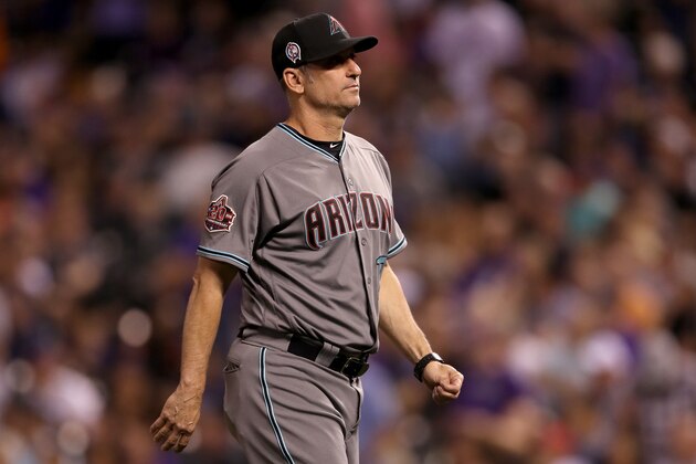 DENVER, CO - SEPTEMBER 11:  Manager Torey Lovullo of the Arizona Diamondbacks walks back to the dugout after changing pitchers in the seventh inning against the Colorado Rockies at Coors Field on September 11, 2018 in Denver, Colorado.  (Photo by Matthew Stockman/Getty Images)
