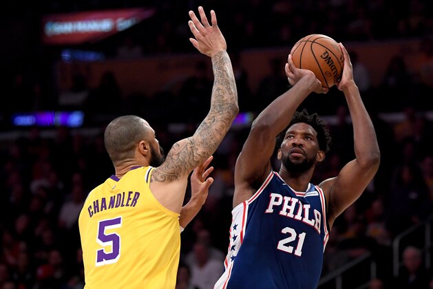 LOS ANGELES, CALIFORNIA - JANUARY 29:  Joel Embiid #21 of the Philadelphia 76ers shoots a fadeaway jumper in front of Tyson Chandler #5 of the Los Angeles Lakers during a 121-105 win at Staples Center on January 29, 2019 in Los Angeles, California.  NOTE TO USER: User expressly acknowledges and agrees that, by downloading and or using this photograph, User is consenting to the terms and conditions of the Getty Images License Agreement.  (Photo by Harry How/Getty Images)