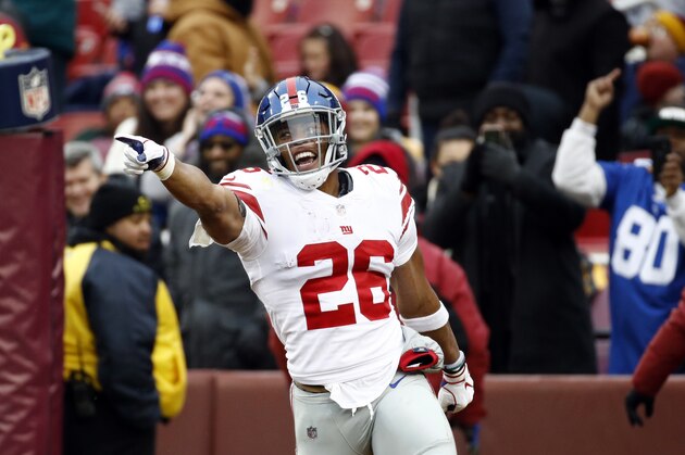 New York Giants running back Saquon Barkley (26) celebrates his 78-yard touchdown during the first half of an NFL football game against the Washington Redskins, Sunday, Dec. 9, 2018, in Landover, Md. (AP Photo/Patrick Semansky)