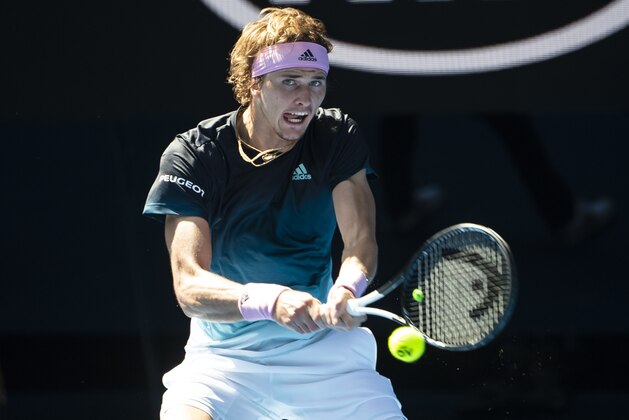 MELBOURNE, AUSTRALIA - JANUARY 21: Alexander Zverev of Germany hits a backhand to Milos Raonic of Canada during day eight of the 2019 Australian Open at Melbourne Park on January 21, 2019 in Melbourne, Australia. (Photo by TPN/Getty Images)