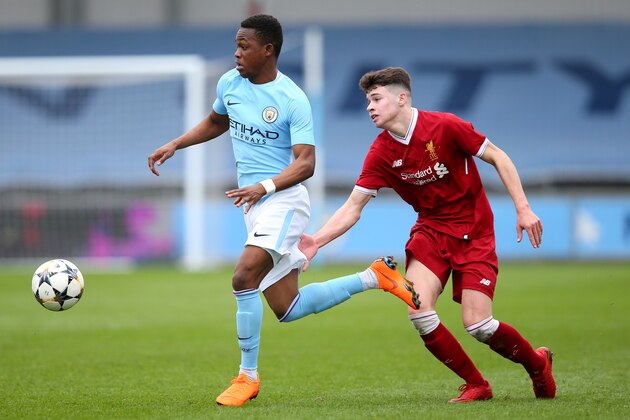 MANCHESTER, ENGLAND - MARCH 14:  Rabbi Matondo of Manchester City and Neco Williams of Liverpool during the UEFA Youth League Quarter-Final between Manchester City and Liverpool  at Manchester City Football Academy on March 14, 2018 in Manchester, England.  (Photo by Alex Livesey/Getty Images)