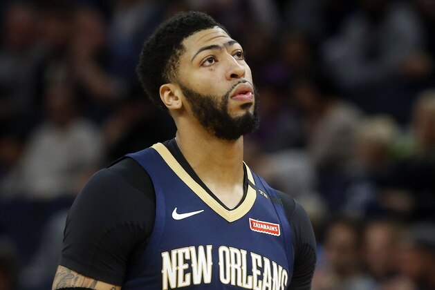 FILE- In this Jan. 12, 2019, file photo New Orleans Pelicans' Anthony Davis plays against the Minnesota Timberwolves in an NBA basketball game in Minneapolis. Davis' agent says the five-time All-Star has told the New Orleans Pelicans that he wants to be traded to a contending team. Agent Rich Paul confirmed the request to The Associated Press early Monday, Jan. 28. (AP Photo/Jim Mone, File)