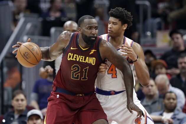 Cleveland Cavaliers' Kendrick Perkins (21) drives past New York Knicks' Isaiah Hicks (4) in the second half of an NBA basketball game, Wednesday, April 11, 2018, in Cleveland. The Knicks won 110-98. (AP Photo/Tony Dejak)