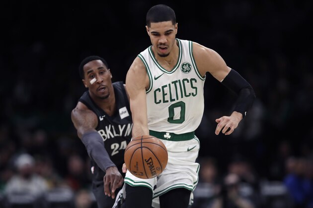 Boston Celtics forward Jayson Tatum (0) outruns Brooklyn Nets forward Rondae Hollis-Jefferson (24) during the second half of an NBA basketball game in Boston, Monday, Jan. 28, 2019. The Celtics won 112-104. (AP Photo/Charles Krupa)