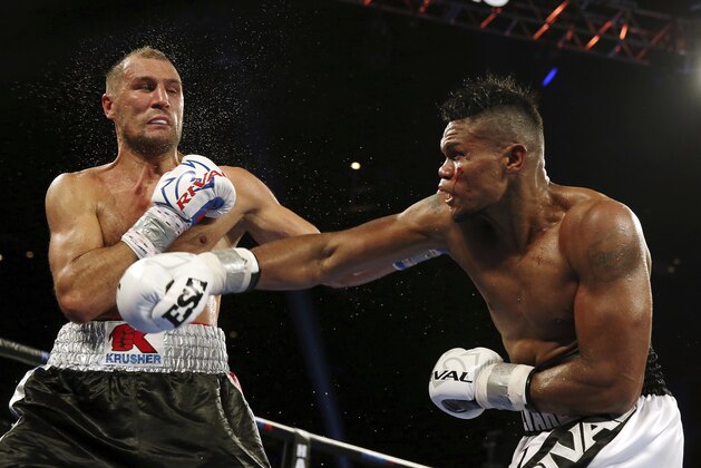 Eleider Alvarez, right, of Colombia, connects a punch to Sergey Kovalev, left, of Russia, during the seventh round of their 175-pound boxing bout Saturday, Aug. 4, 2018, in Atlantic City, N.J. Alvarez won by knockout in the seventh round. (AP Photo/Mel Evans)