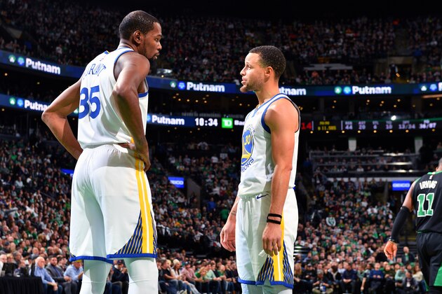 BOSTON, MA - JANUARY 26: Kevin Durant #35 and Stephen Curry #30 of the Golden State Warriors talk during the game against the Boston Celtics on January 26, 2019 at the TD Garden in Boston, Massachusetts. NOTE TO USER: User expressly acknowledges and agrees that, by downloading and/or using this photograph, user is consenting to the terms and conditions of the Getty Images License Agreement. Mandatory Copyright Notice: Copyright 2019 NBAE (Photo by Jesse D. Garrabrant/NBAE via Getty Images)