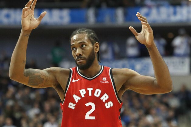 Toronto Raptors forward Kawhi Leonard (2) reacts to a call on a teammate during the second half of an NBA basketball game against the Dallas Mavericks in Dallas, Sunday, Jan. 27, 2019.  (AP Photo/LM Otero)