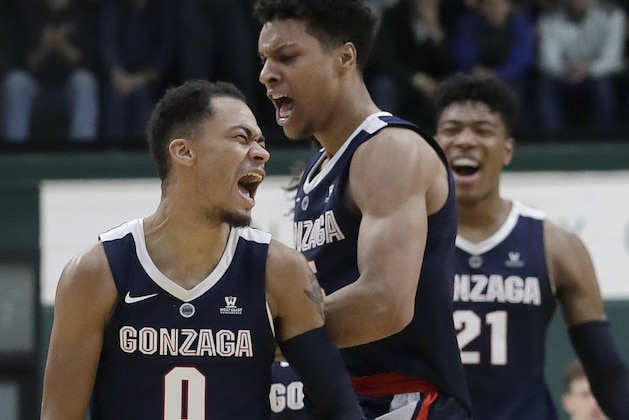 Gonzaga guard Geno Crandall (0) celebrates with Brandon Clarke, center, and Rui Hachimura (21) after scoring against San Francisco during the second half of an NCAA college basketball game in San Francisco, Saturday, Jan. 12, 2019. (AP Photo/Jeff Chiu)